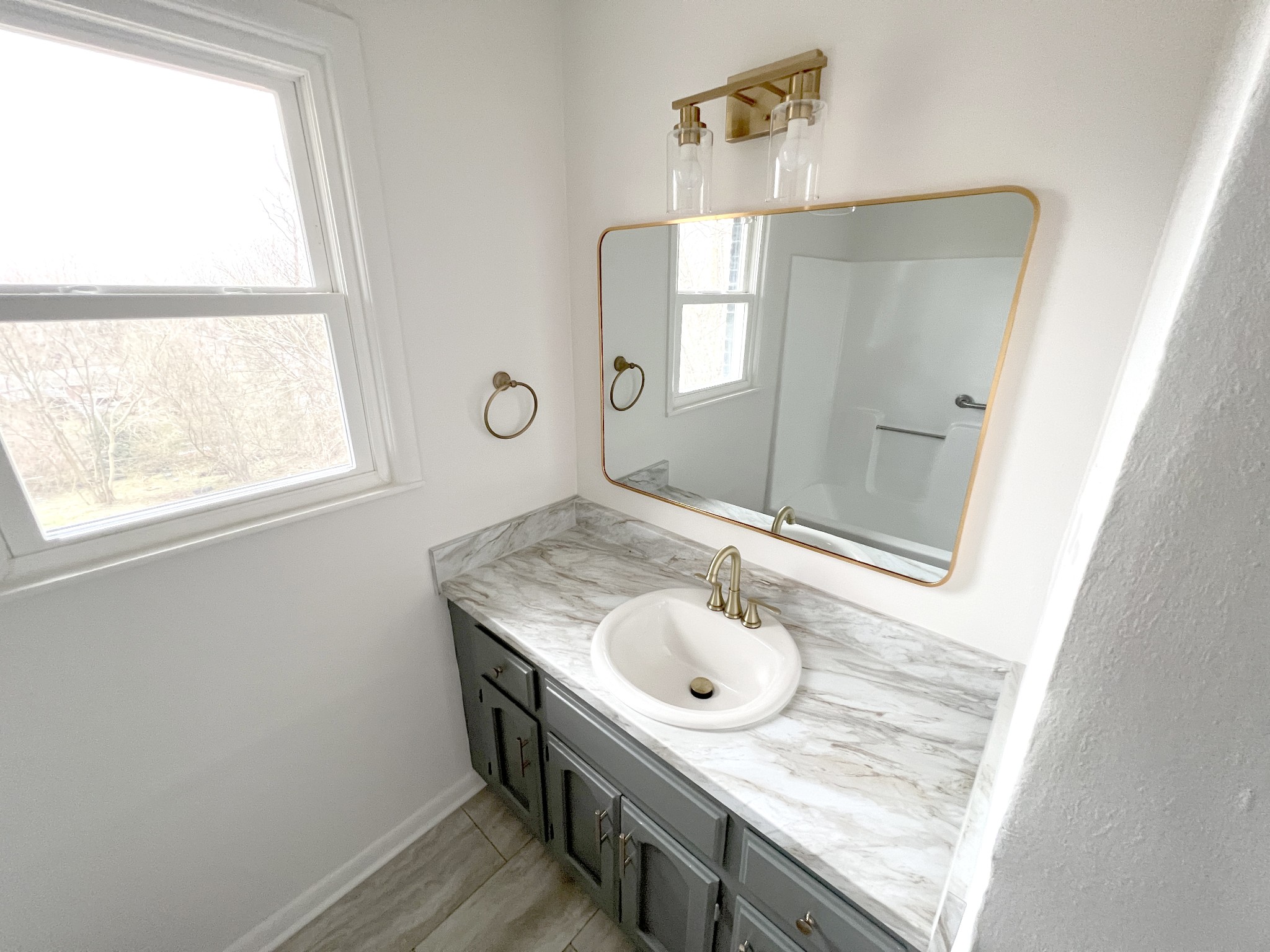 505 High Point Road Clarksville, TN 37042 - Photo 29 of 39 a bathroom with a granite countertop sink and a mirror