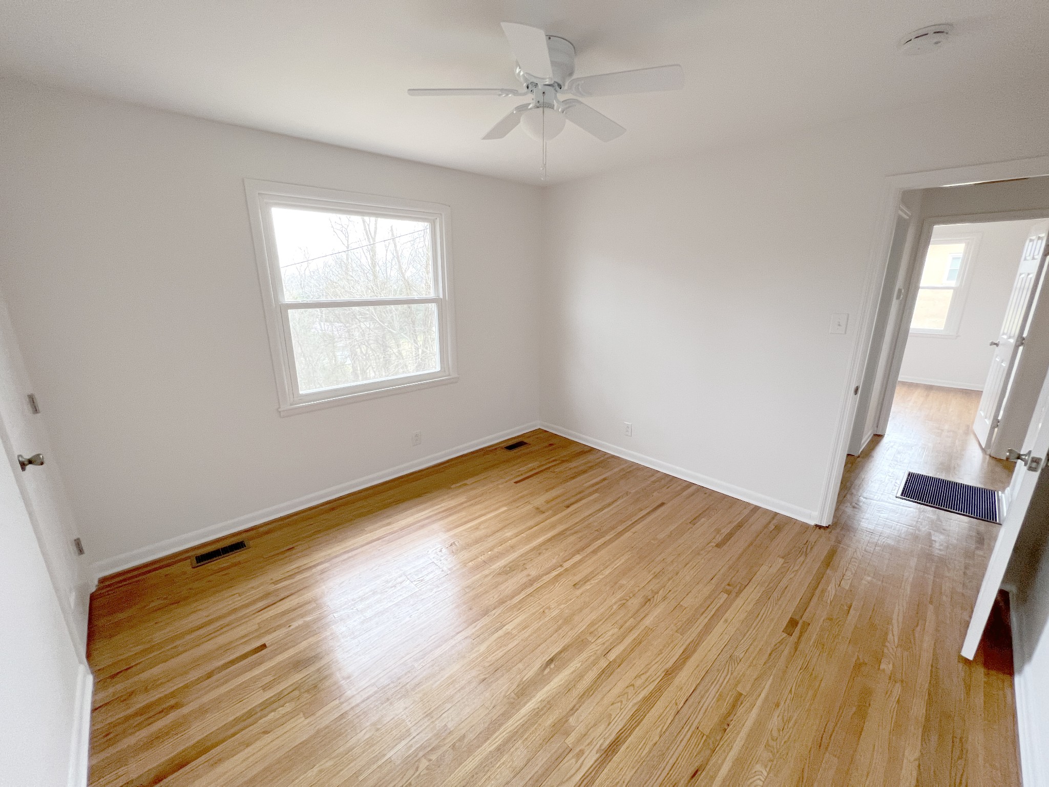 505 High Point Road Clarksville, TN 37042 - Photo 33 of 39 a view of empty room with wooden floor and fan