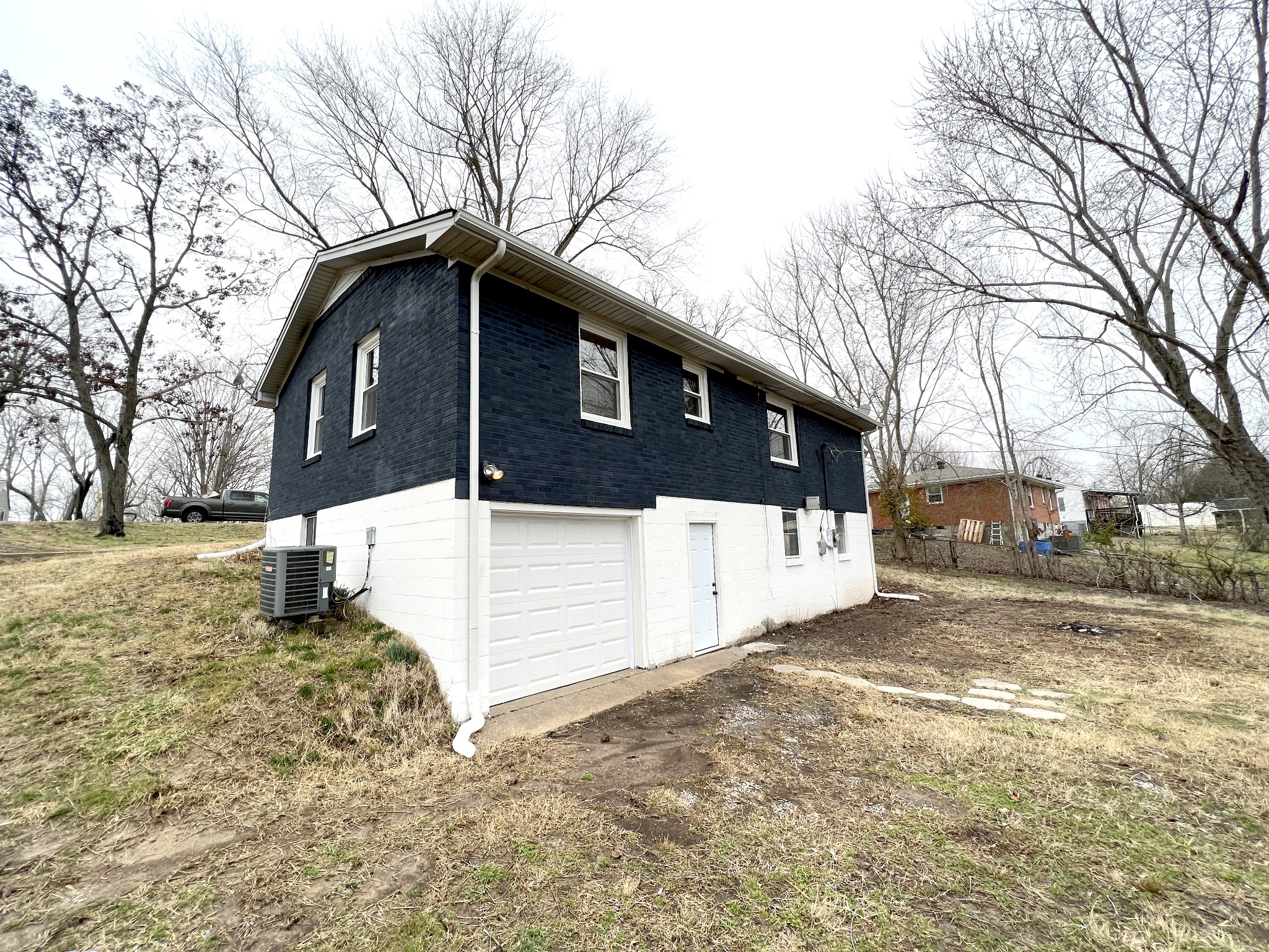 505 High Point Road Clarksville, TN 37042 - Photo 7 of 39 a white house that has tree in front of it