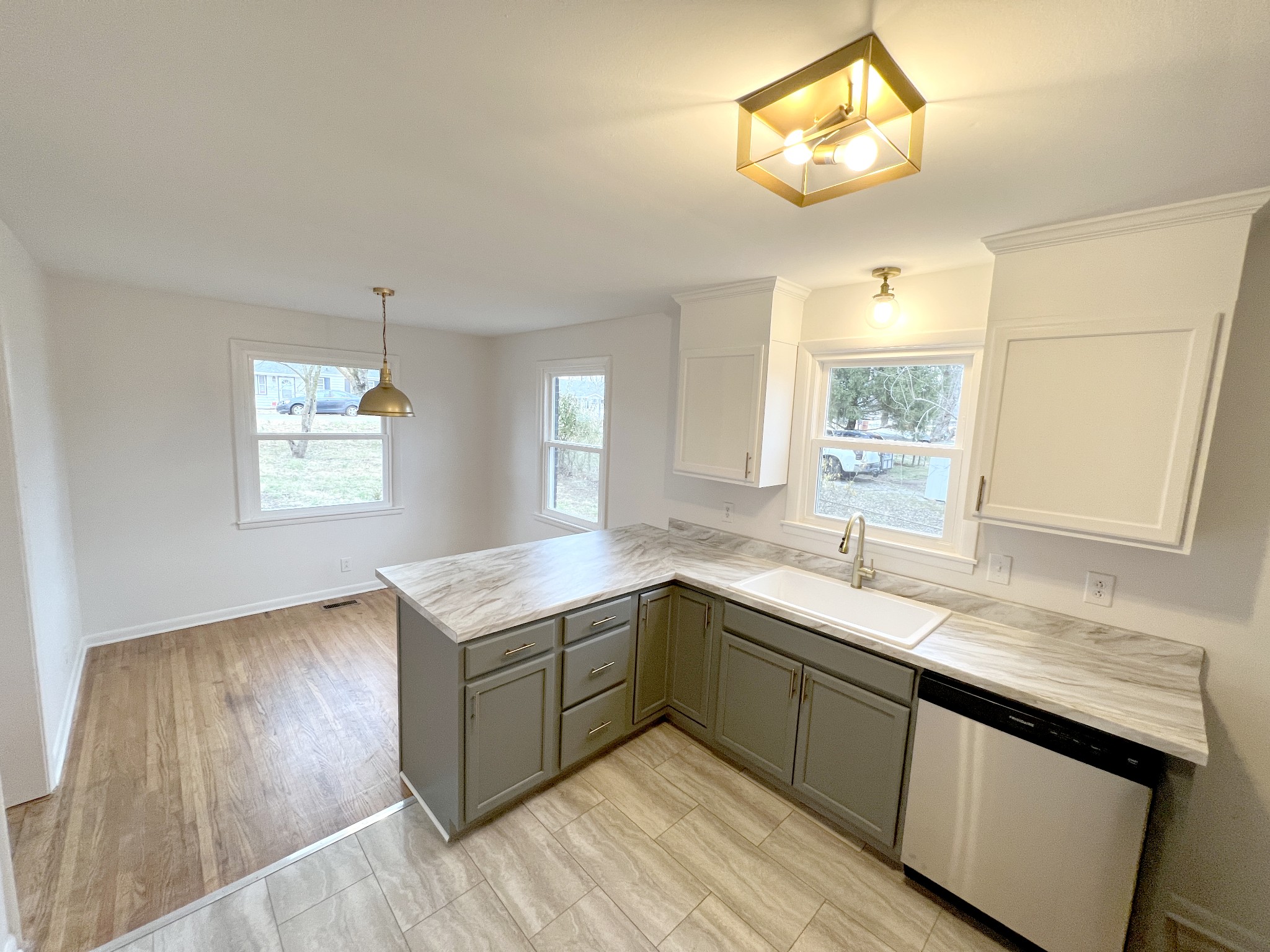 505 High Point Road Clarksville, TN 37042 - Photo 9 of 39 a kitchen with a stove a sink and a window