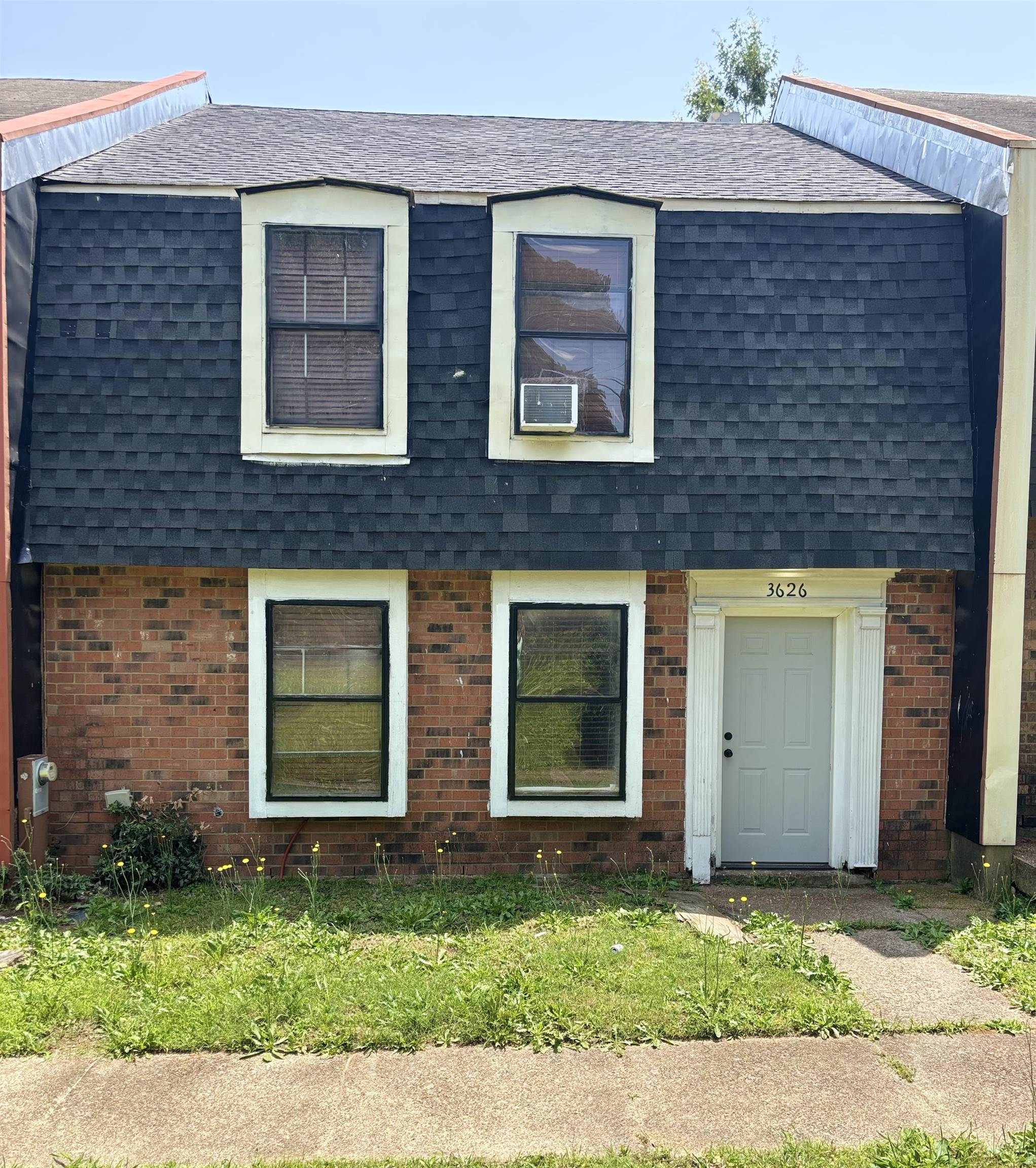 3626 Outland Road, Unit 86 Memphis, TN 38118 - Photo 1 of 24 a brick house that has a small yard in front of it