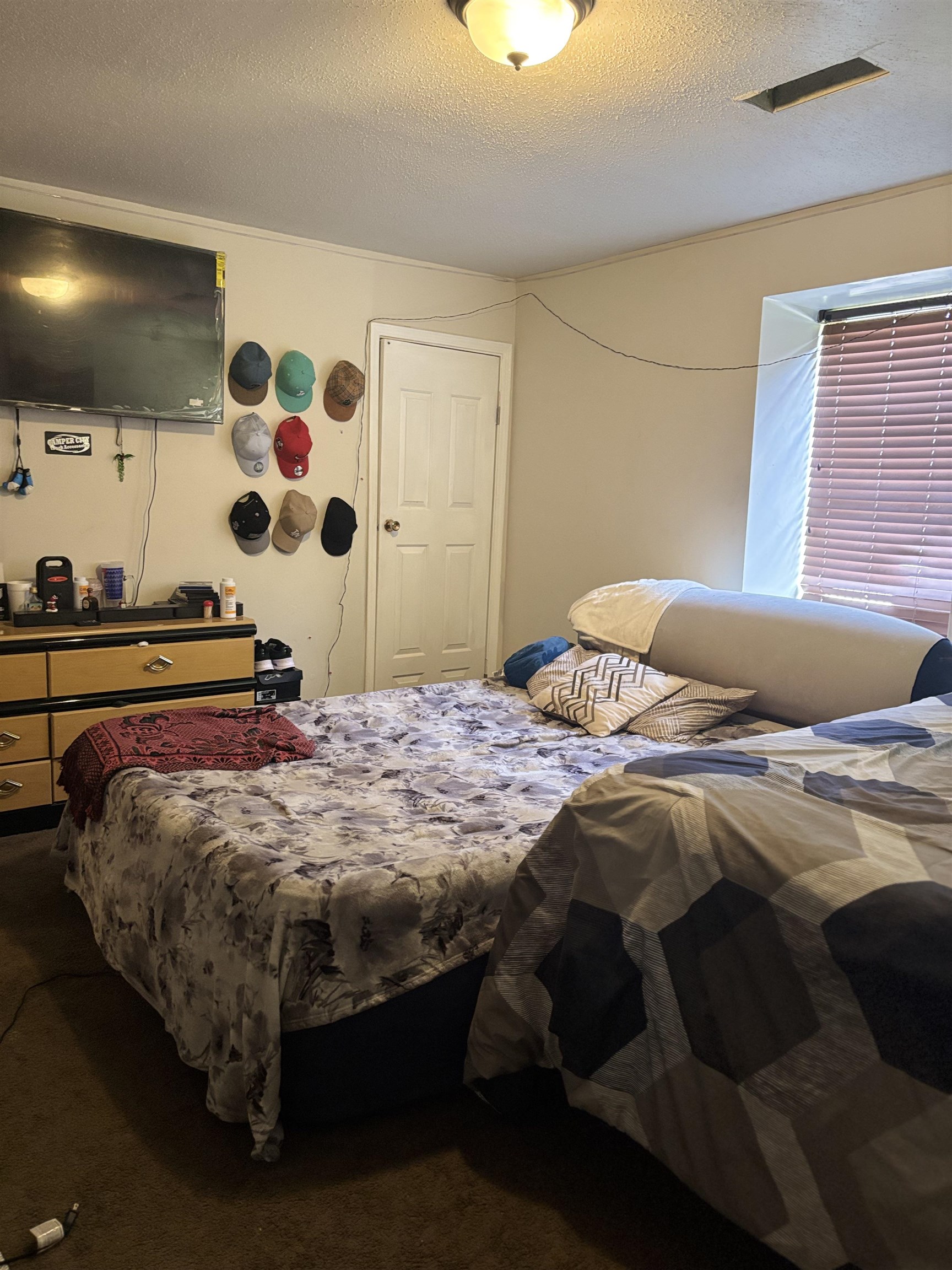 3626 Outland Road, Unit 86 Memphis, TN 38118 - Photo 12 of 24 a bedroom with a bed and a flat screen tv