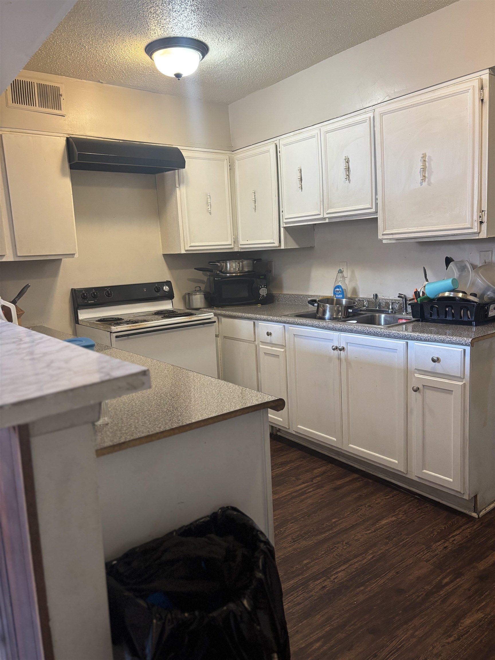 3626 Outland Road, Unit 86 Memphis, TN 38118 - Photo 5 of 24 a kitchen with stainless steel appliances a stove a sink and white cabinets