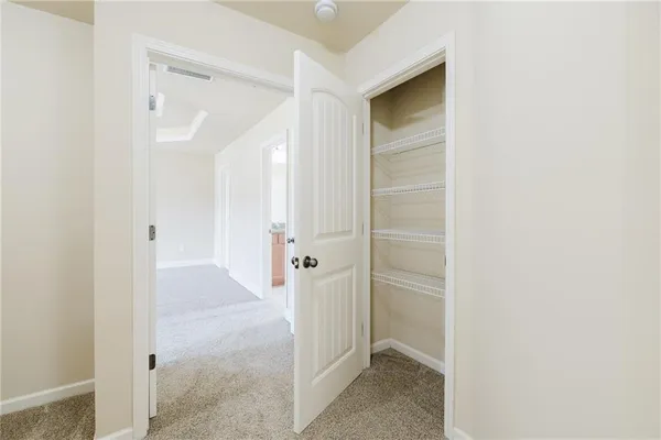 a view of a hallway with two rooms
