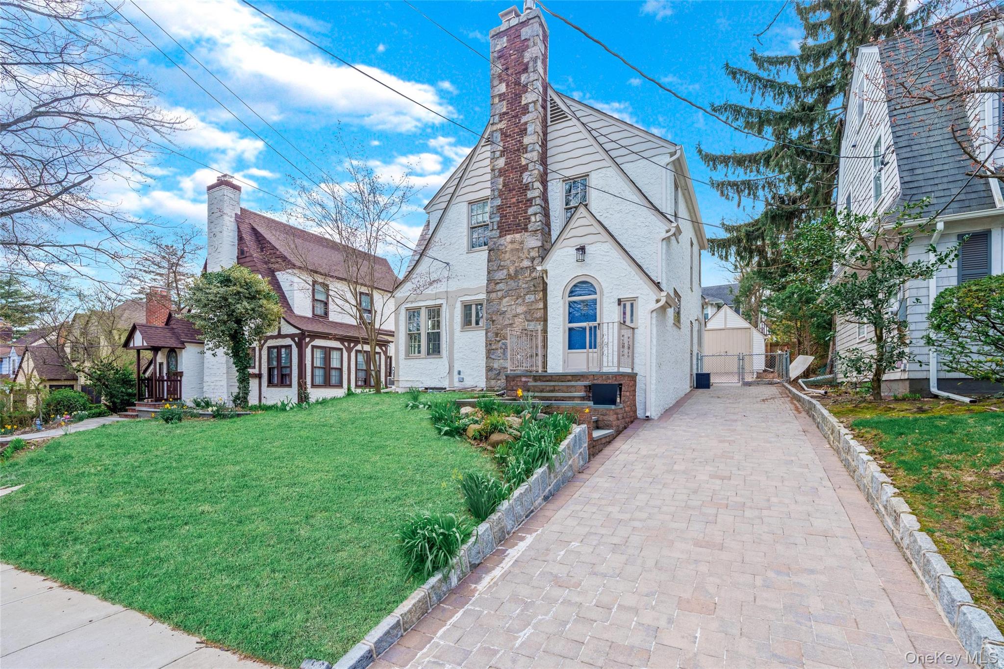 340 Manor Road Queens, NY 11363 - Photo 2 of 34 Brick paver driveway lined with cobble stone