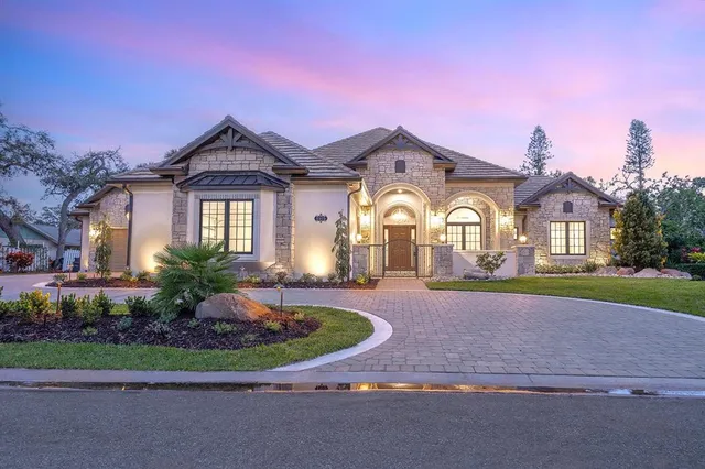 an aerial view of house with yard swimming pool and outdoor seating