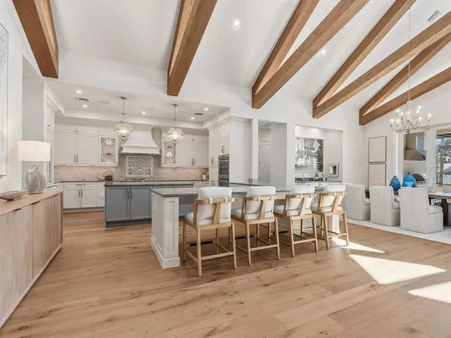 a kitchen with stainless steel appliances granite countertop a stove and cabinets