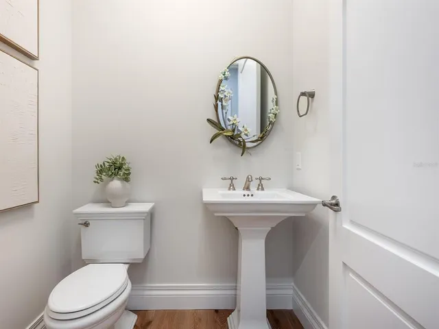 a bathroom with a granite countertop sink a shower and a mirror
