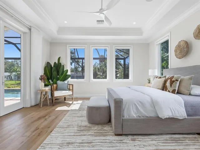 a bathroom with a toilet sink vanity and mirror