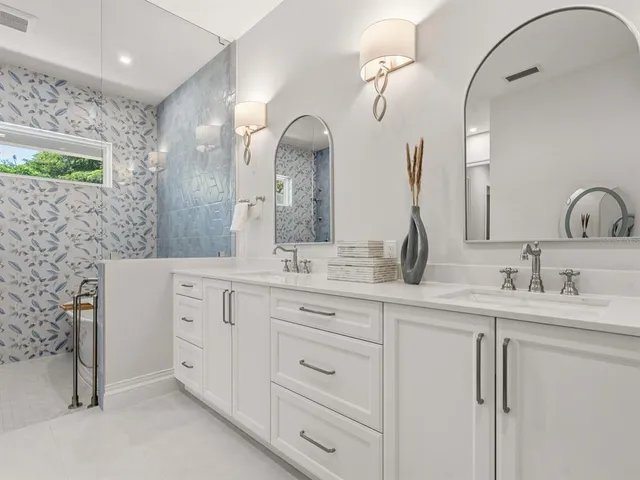a kitchen with a stove cabinets and a window