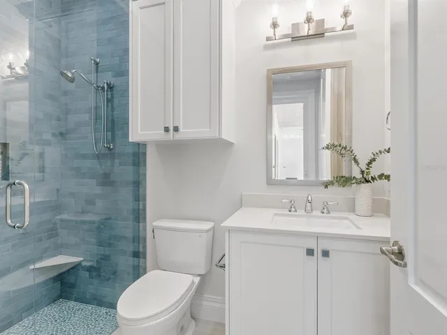 a view of a house with a yard and garage