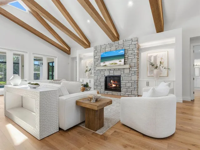a large kitchen with a table and chairs