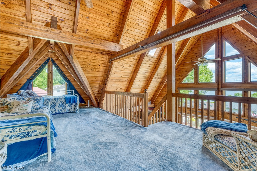 55265 Jim Ball Road Senecaville, OH 43780 - Photo 24 of 44 Carpeted bedroom featuring beamed ceiling, high vaulted ceiling, and wood ceiling