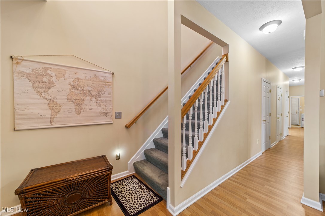 4461 Sexton Road Cleveland, OH 44105 - Photo 22 of 47 Stairs with baseboards and wood finished floors