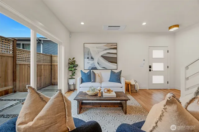a living room with furniture or couch and a potted plant
