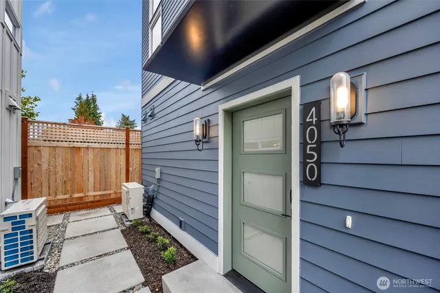 a view of a house with a door and wooden walls