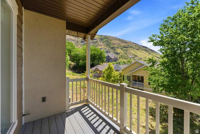 1614 Aspen Loop Provo, UT 84606 - Photo 40 of 47 Private balcony featuring composite decking and a white railing overlooking a verdant hillside