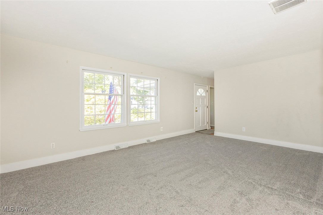 1691 Harwich Road Lyndhurst, OH 44124 - Photo 11 of 45 Carpeted living room with baseboards