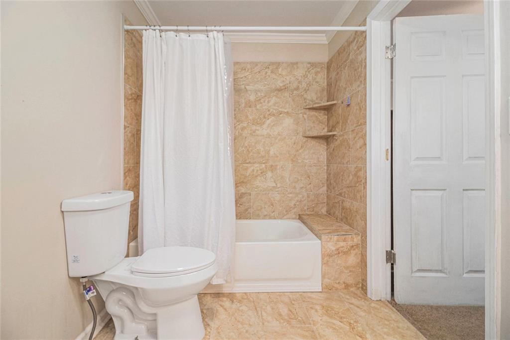 128 Highland Drive West Point, GA 31833 - Photo 15 of 22 a bathroom with a toilet and shower