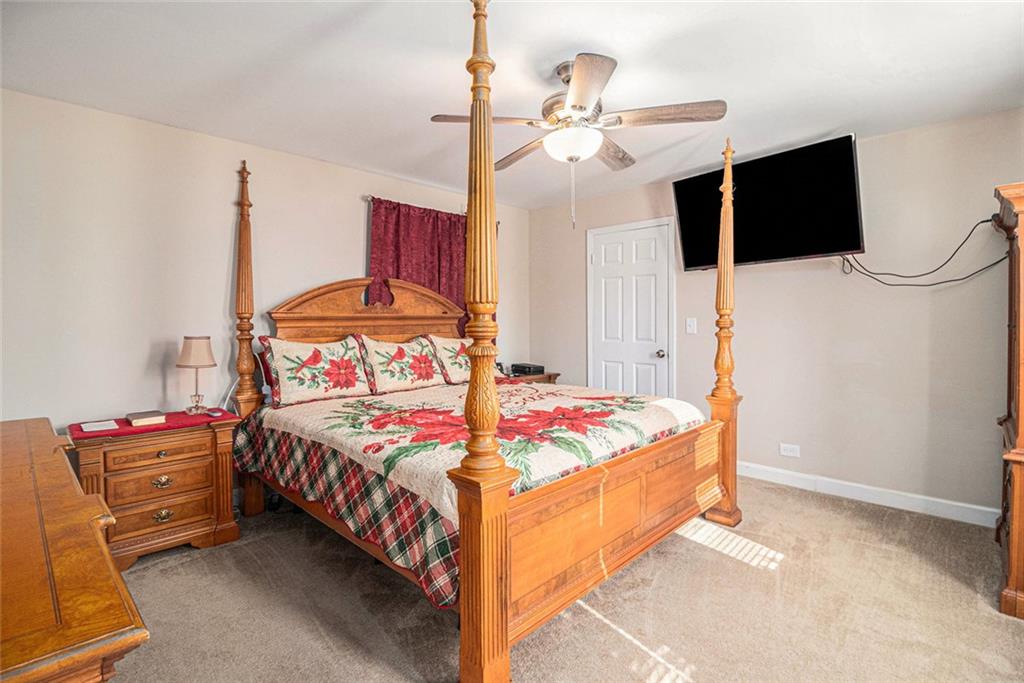 128 Highland Drive West Point, GA 31833 - Photo 17 of 22 a bedroom with bed and flat tv