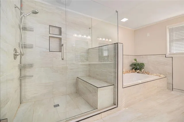 a bathroom with a glass shower door