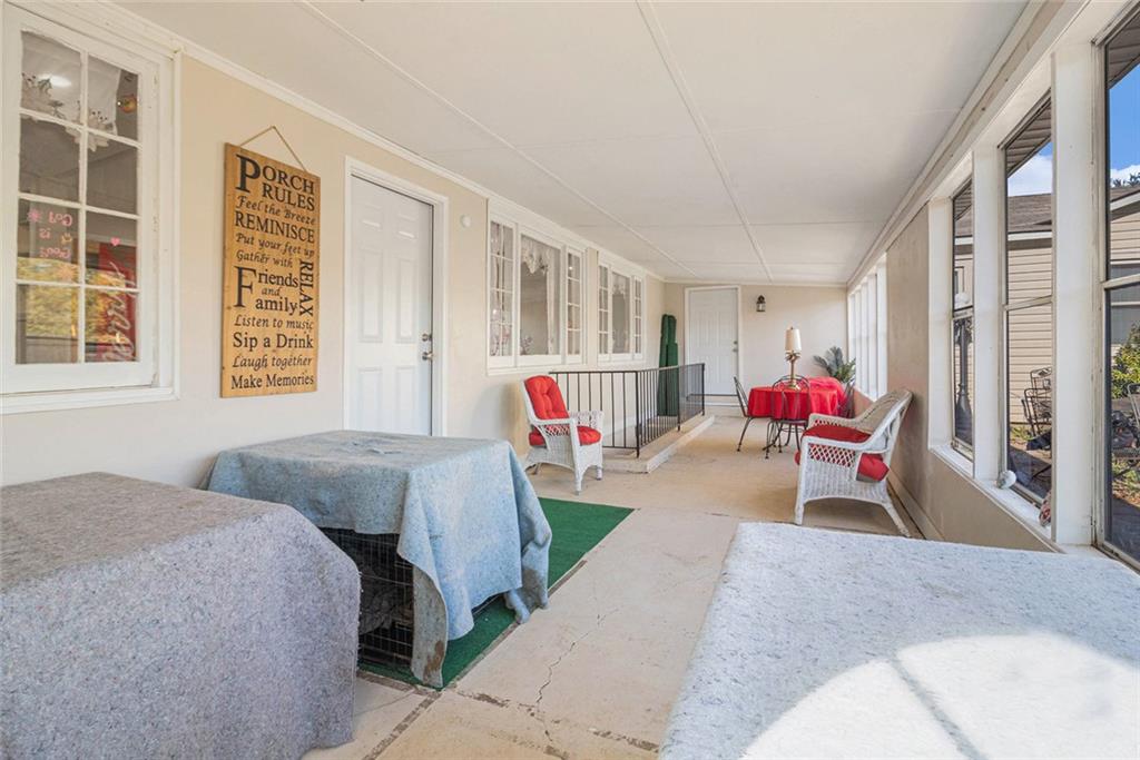 128 Highland Drive West Point, GA 31833 - Photo 20 of 22 a bedroom with a bed and a window