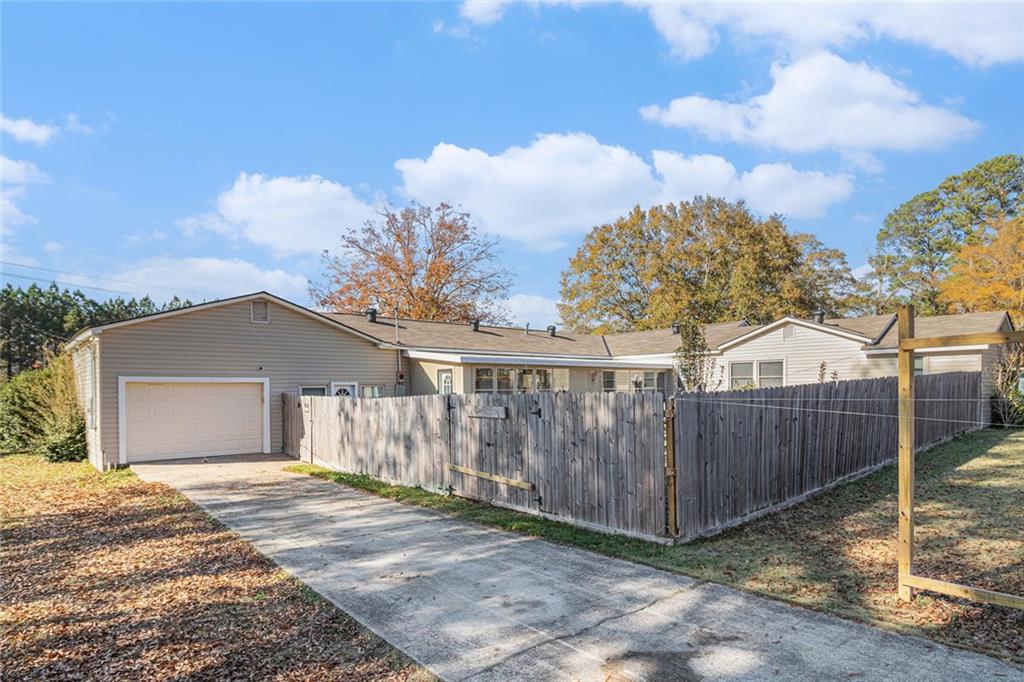 128 Highland Drive West Point, GA 31833 - Photo 22 of 22 a view of a house with wooden fence