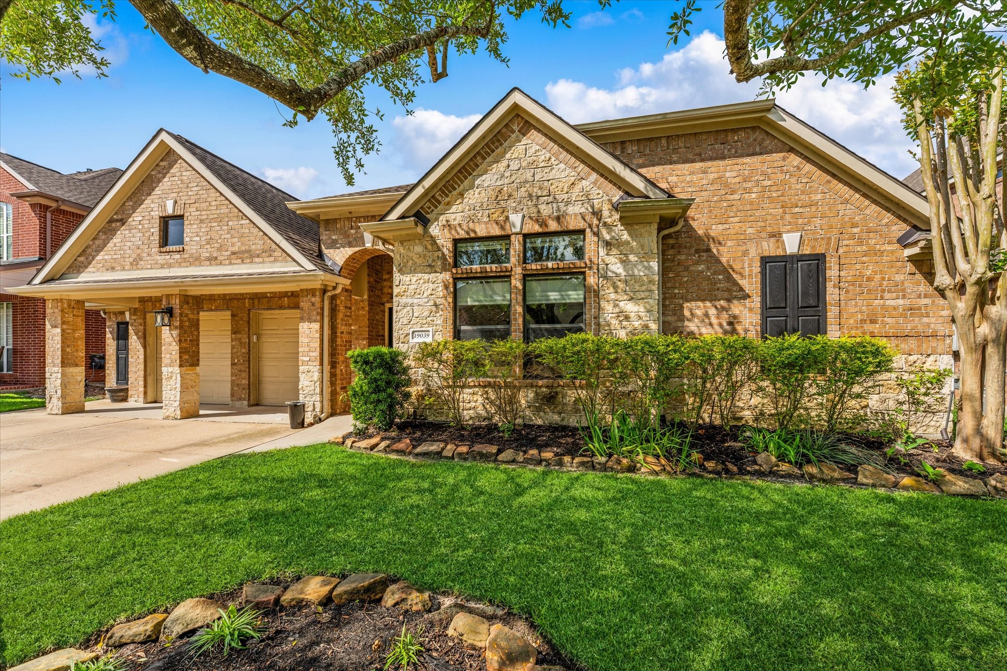 19039 Panther Peak Spring, TX 77388 - Photo 4 of 49 front view of a house with a yard
