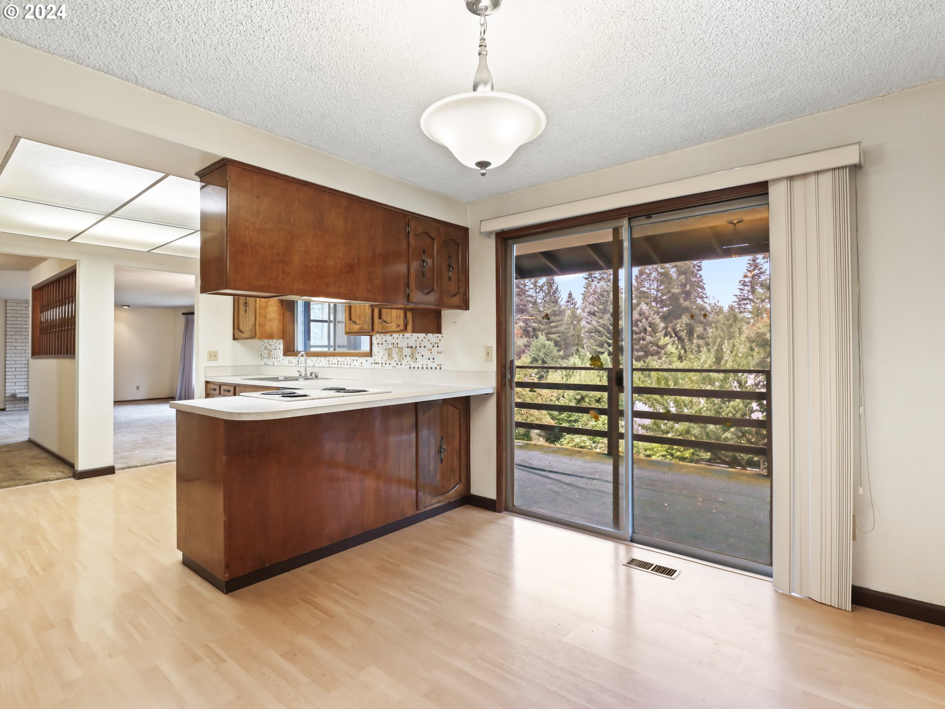 2002 Northwest 127th Street Vancouver, WA 98685 - Photo 14 of 33 a room with wooden cabinets and outdoor seating