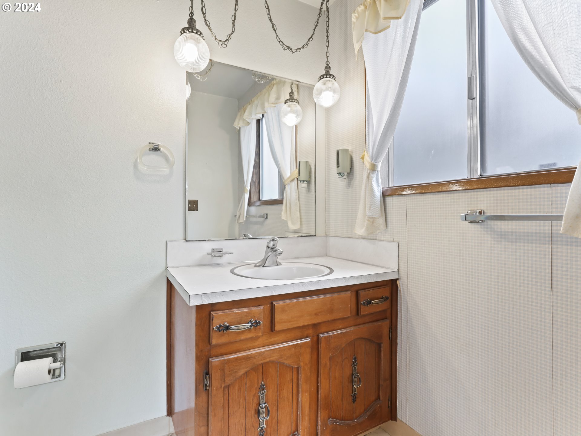 2002 Northwest 127th Street Vancouver, WA 98685 - Photo 16 of 33 a bathroom with a sink a vanity and a mirror