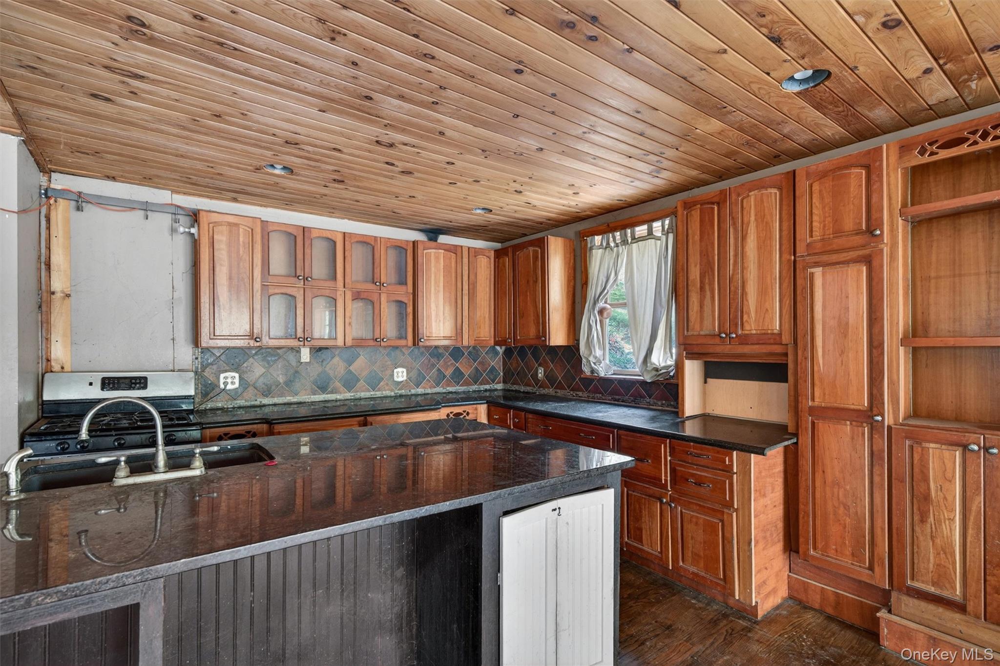 360 Buttermilk Falls Road Warwick, NY 10990 - Photo 13 of 30 a kitchen with a sink a counter top space and cabinets