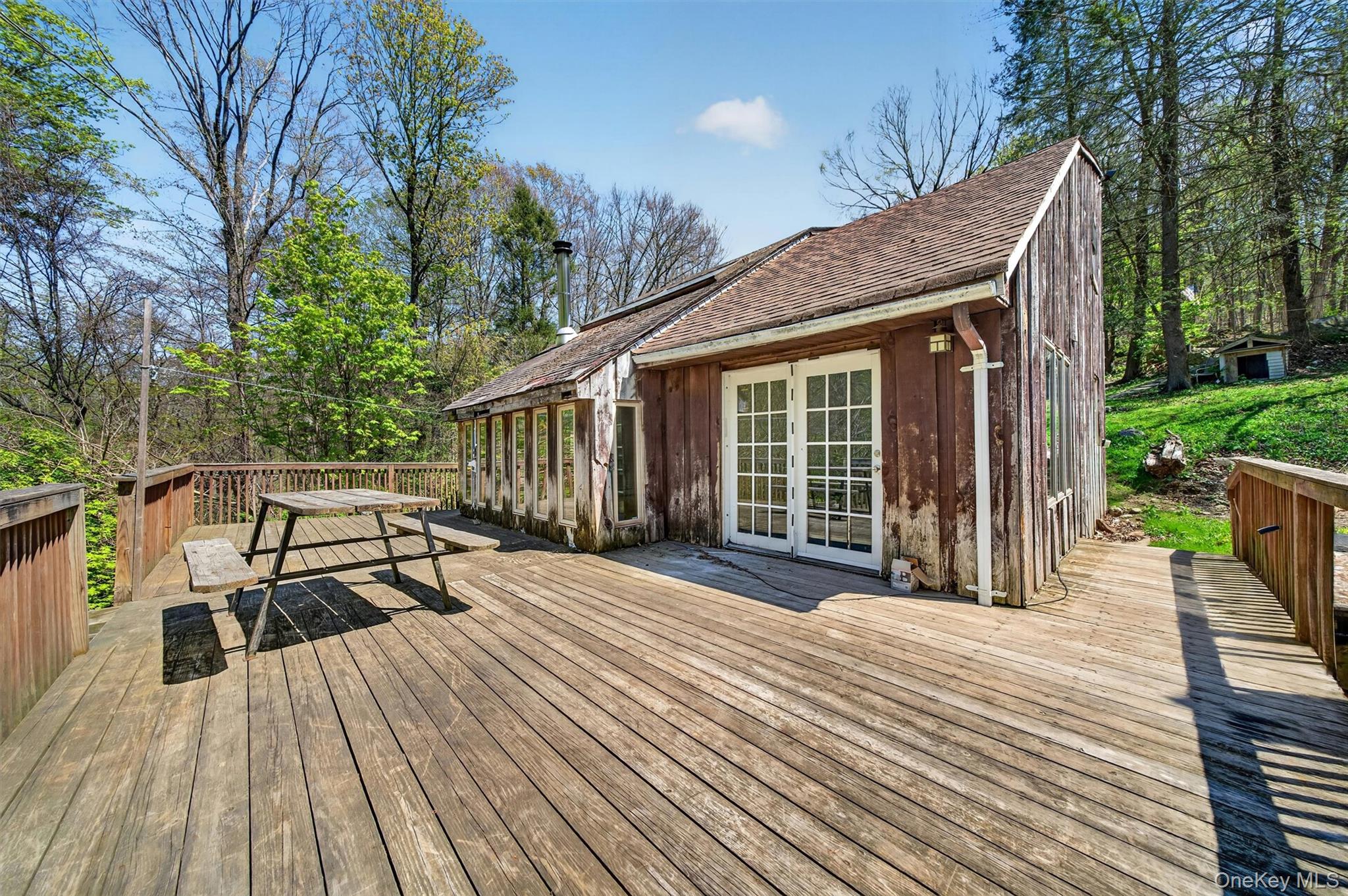 360 Buttermilk Falls Road Warwick, NY 10990 - Photo 23 of 30 a view of a house with wooden deck