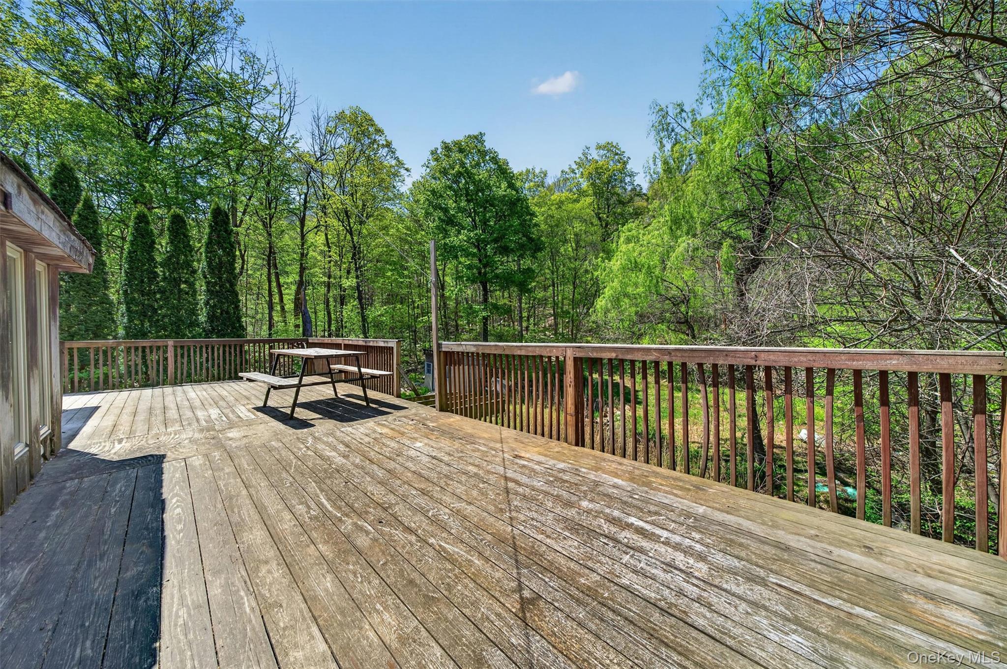 360 Buttermilk Falls Road Warwick, NY 10990 - Photo 24 of 30 a view of balcony with wooden floor and outdoor seating