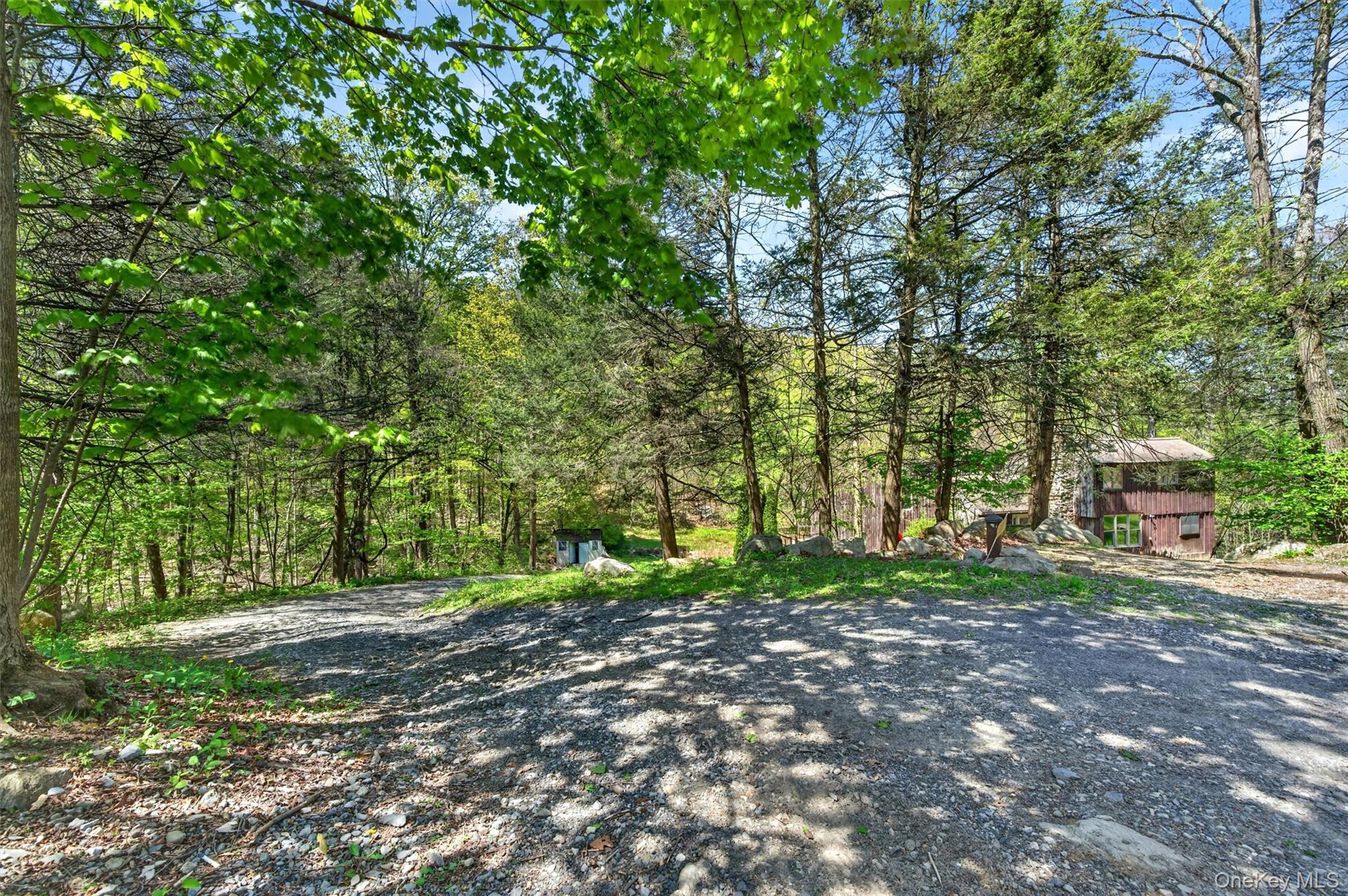 360 Buttermilk Falls Road Warwick, NY 10990 - Photo 29 of 30 a backyard of a house with trees and plants