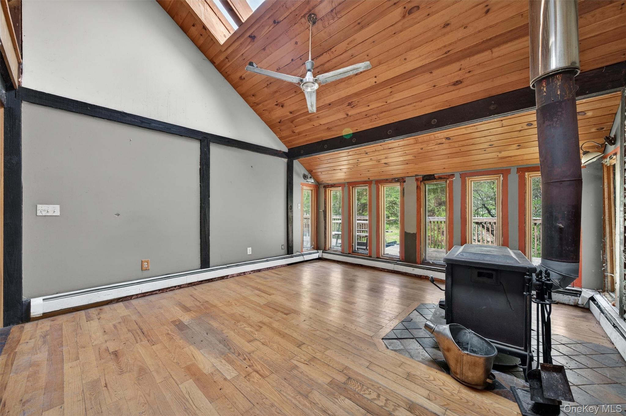360 Buttermilk Falls Road Warwick, NY 10990 - Photo 8 of 30 a view of empty room with wooden floor and furniture