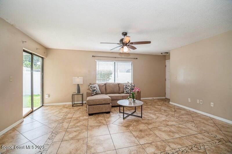 2418 Delys Street Cocoa, FL 32926 - Photo 5 of 12 a living room with furniture and a large window