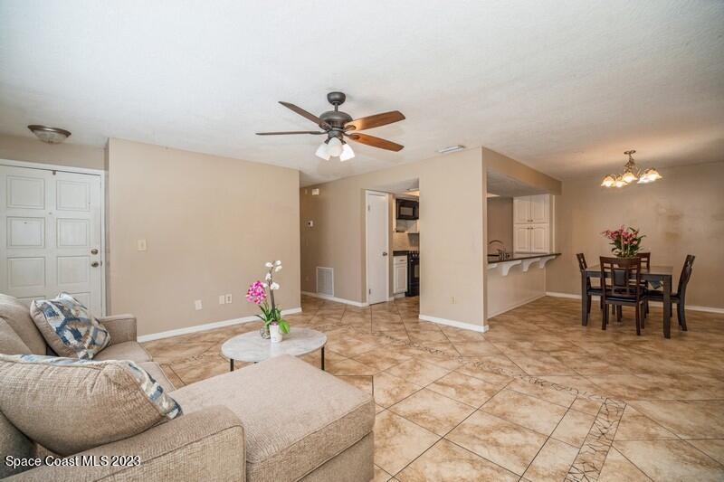 2418 Delys Street Cocoa, FL 32926 - Photo 6 of 12 a living room with furniture and kitchen view