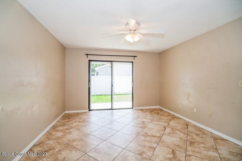 2418 Delys Street Cocoa, FL 32926 - Photo 7 of 12 a view of an empty room with a window