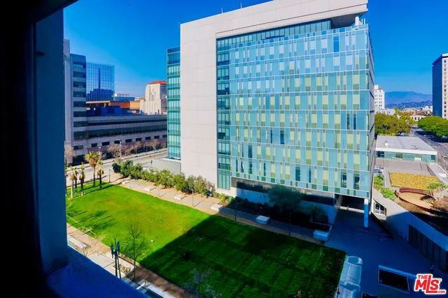 a view of swimming pool from a living room