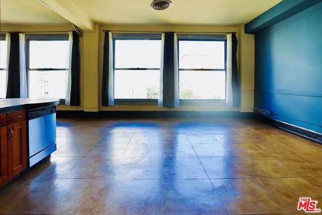 a view of room with window and hardwood