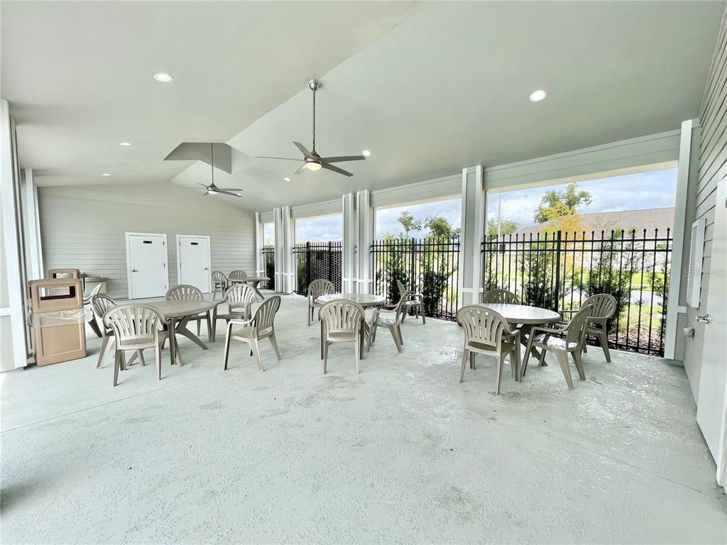 1021 Southwest 67th Street Gainesville, FL 32607 - Photo 45 of 53 a room with lots of tables and chairs