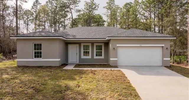 a house with yard in front of it