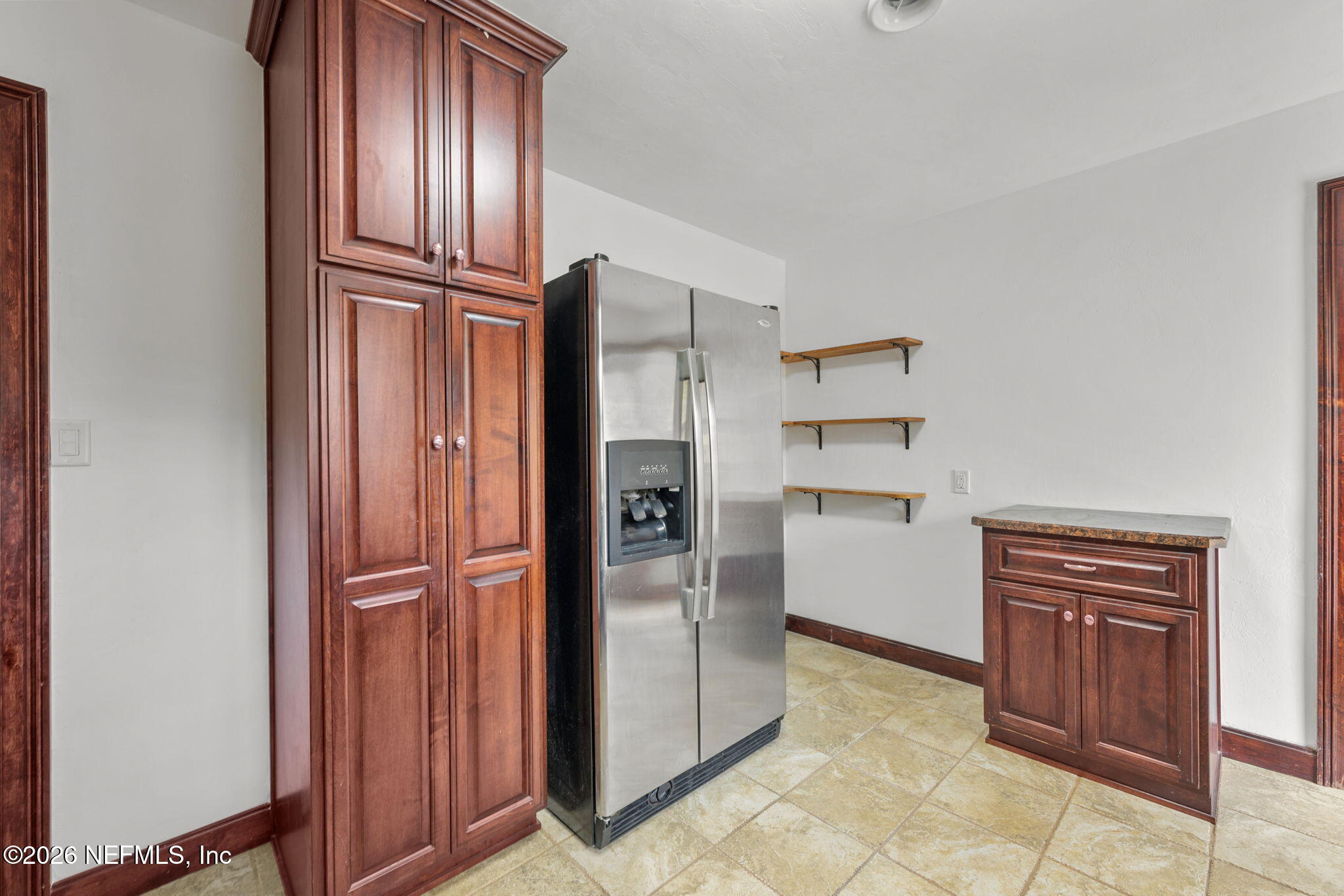 2003 Laurel Street Palatka, FL 32177 - Photo 13 of 31 a kitchen with stainless steel appliances a refrigerator and cabinets