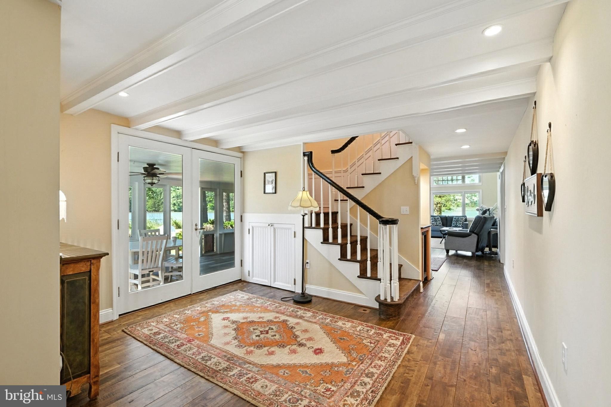 7312 Solitude Road St. Michaels, MD 21663 - Photo 10 of 43 workspace with wooden floor and stairs