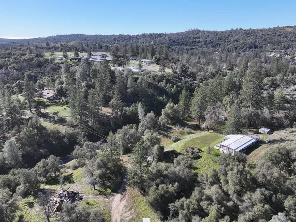 an aerial view of residential house with outdoor space