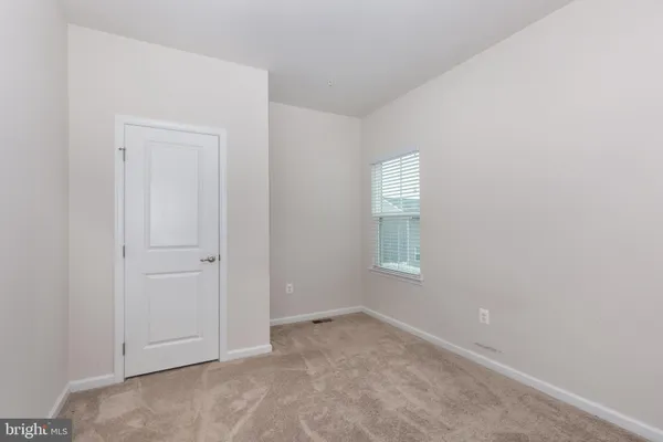 a view of a hallway with stairs