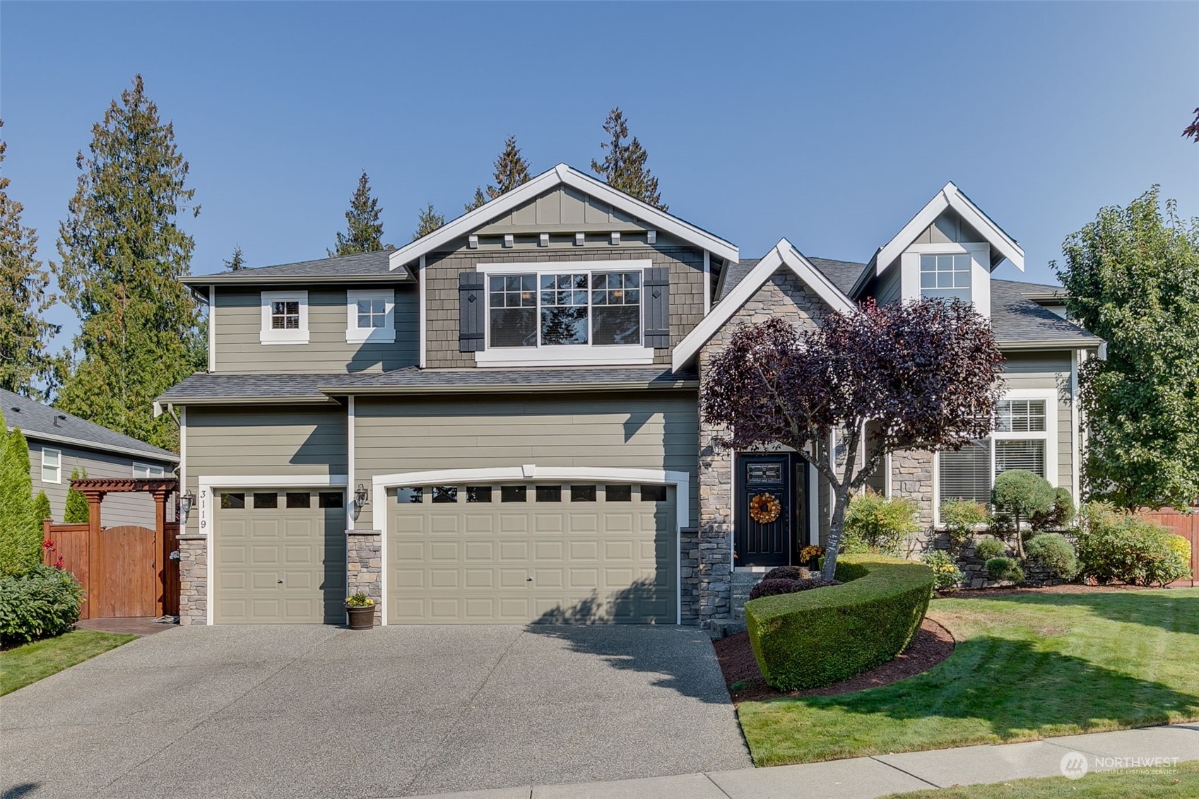 3119 223rd Street Southeast Bothell, WA 98021 - Photo 1 of 40 a front view of a house with a yard and garage