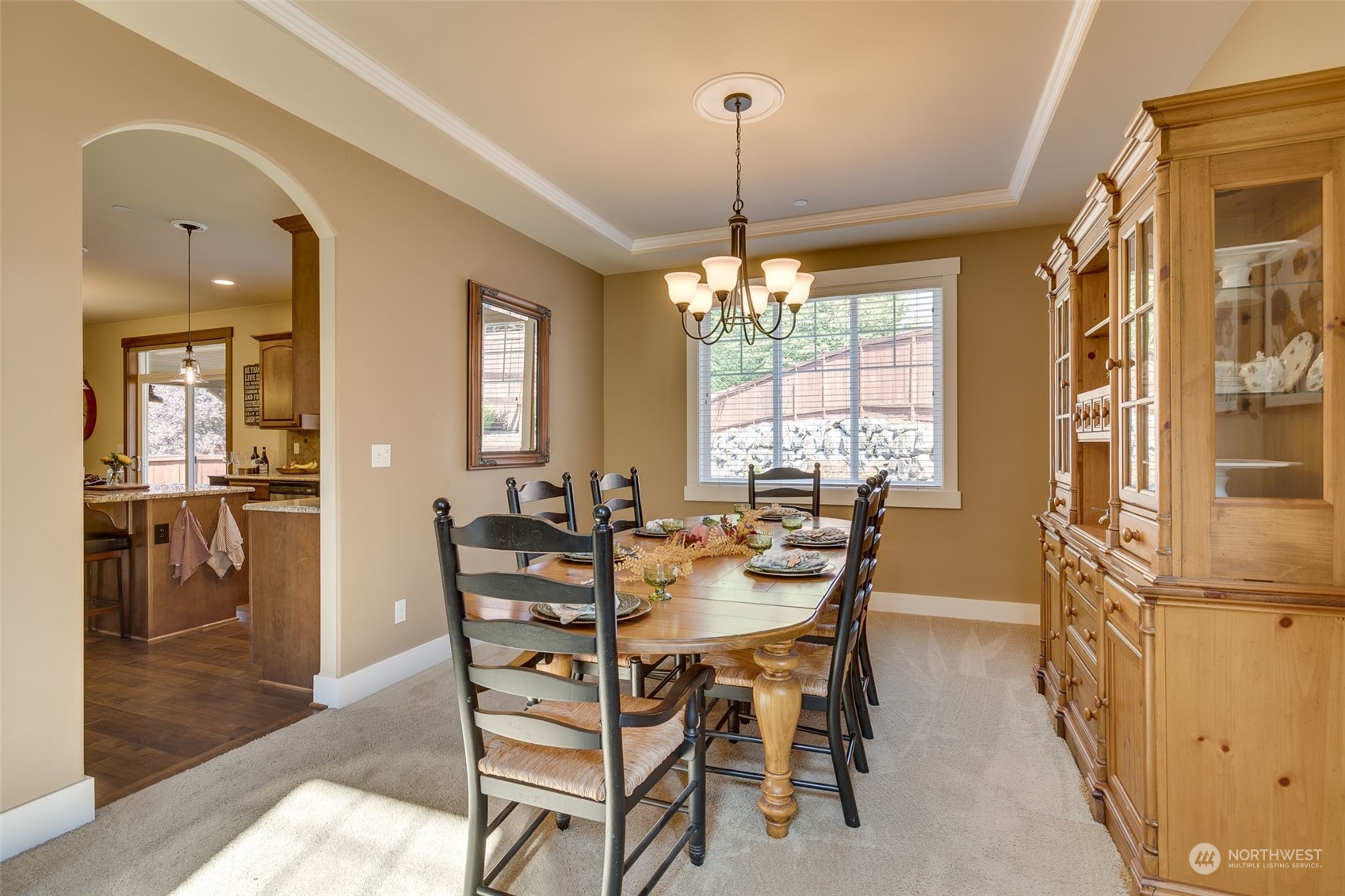 3119 223rd Street Southeast Bothell, WA 98021 - Photo 11 of 40 a view of a dining room with furniture window and wooden floor