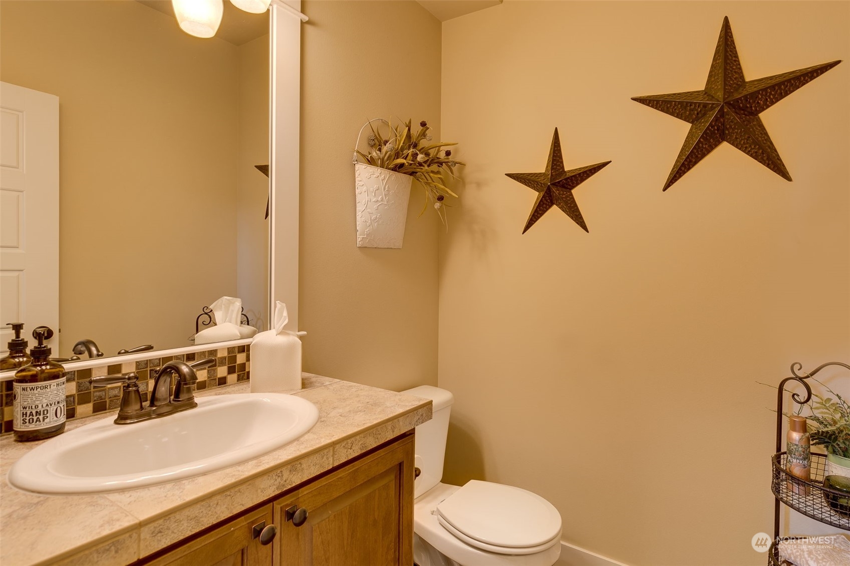 3119 223rd Street Southeast Bothell, WA 98021 - Photo 17 of 40 a bathroom with a granite countertop sink toilet and a mirror