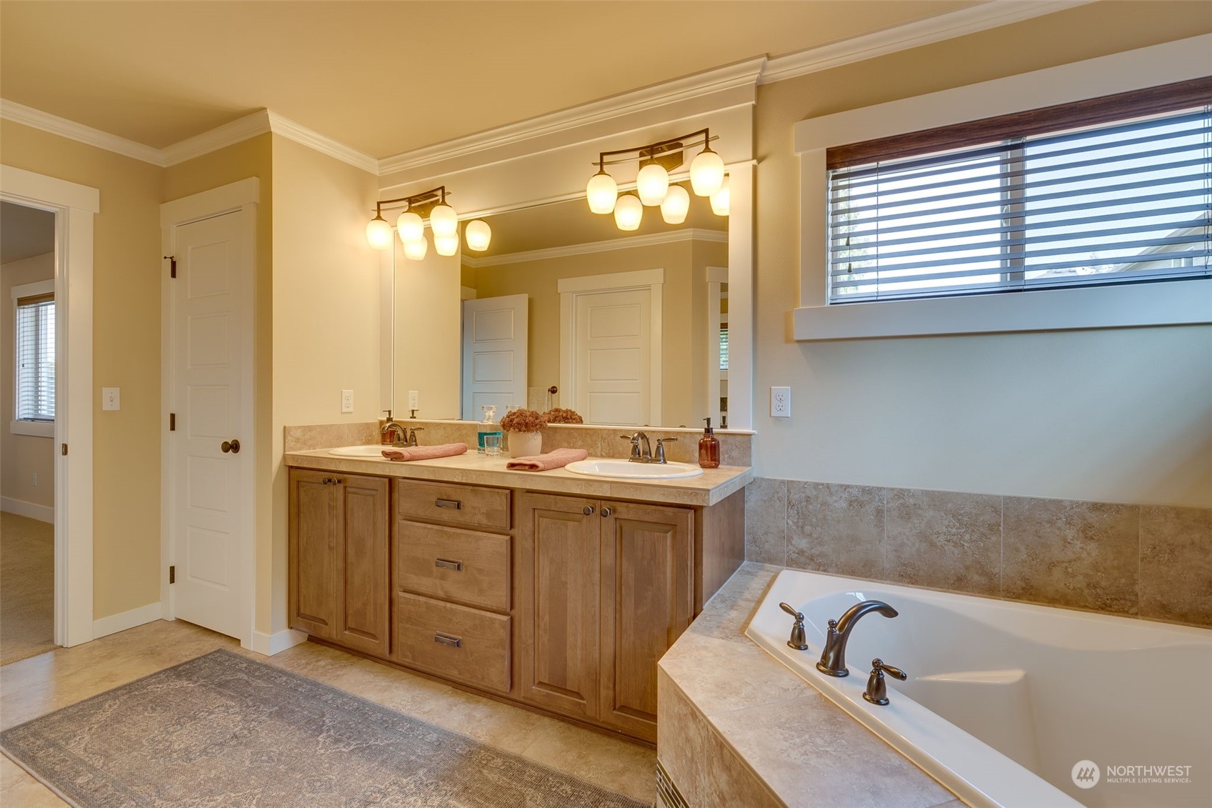 3119 223rd Street Southeast Bothell, WA 98021 - Photo 20 of 40 a bathroom with a tub sink and mirror
